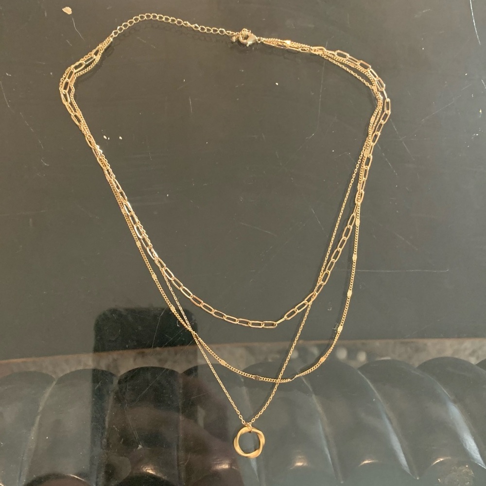 Layered gold necklace.